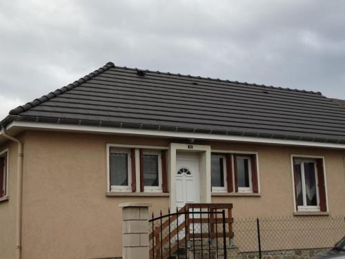 Rénovation d'une toiture mitoyenne en tuilles terre cuite à Ussel